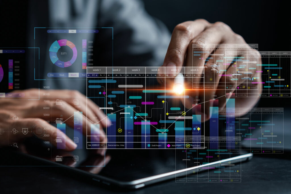 Analyst working with computer in Business Analytics and Data Management System to make report with KPI and metrics connected to database. Corporate strategy for finance operations sales marketing