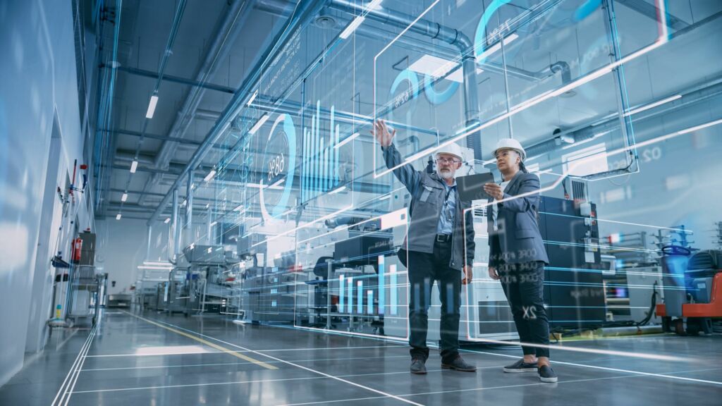 FactoryDigitalizationTwoIndustrialEngineersUseTabletComputerVisualizeThe