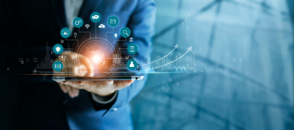 Businessman using tablet analyzing sales data and economic growt