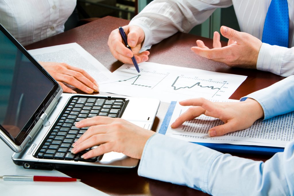 Image of three business peopleís hands at working meeting